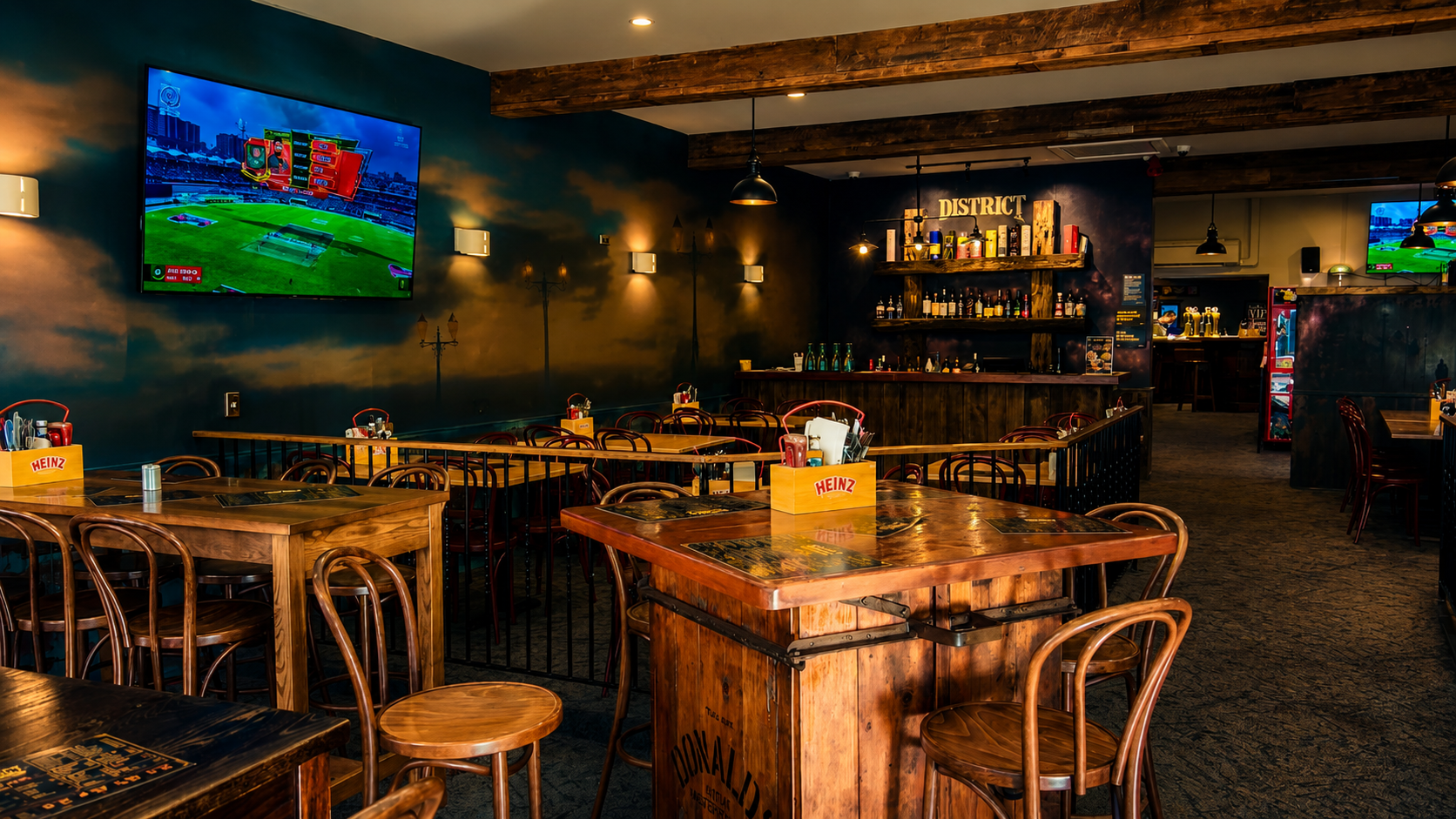 District Bar & Kitchen interior with guests enjoying the atmosphere